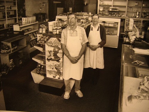 Tom and Frank Becco in aprons inside Becco's Market, 1989